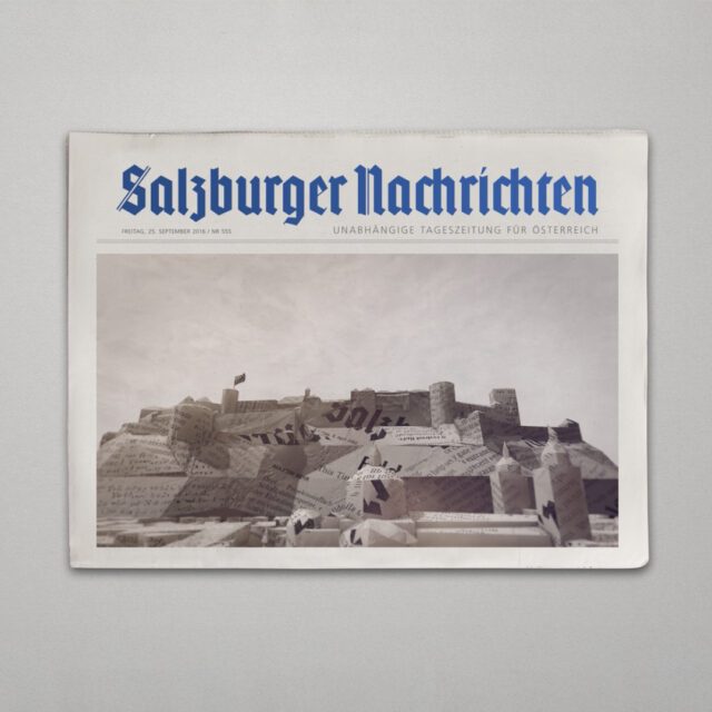 Zeitung mit Titelblatt der Salzburger Nachrichten und einem 3D Motiv aus Papierlandschaft