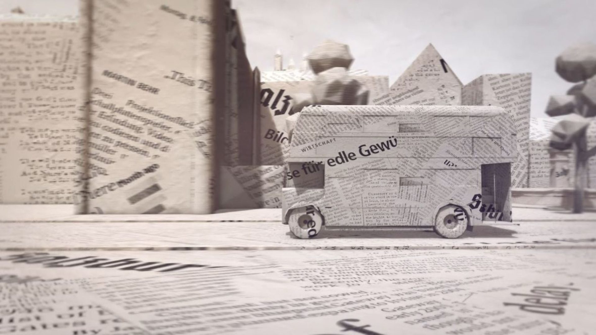 3D Modell eines Doppeldeckerbusses aus Zeitungspapier in einer stilisierten Stadtlandschaft