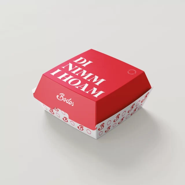 Dialekt als Designelement: Hier reicht der bayerische Charme in jedes Detail. Takeaway-Box mit bayerischem Markenwording und Muster als Verpackungsdesign